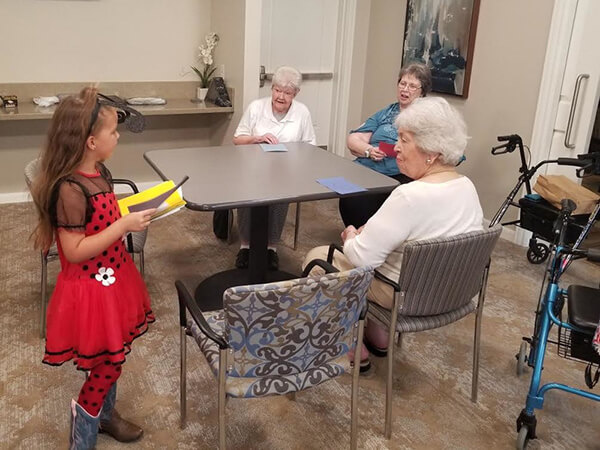 Local Kids Give Back By Passing Out Treats To HarborChase Residents